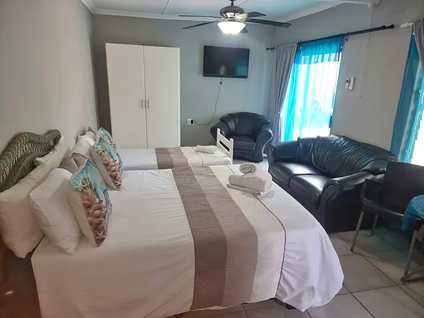 Bedroom and seating area in Unit 3