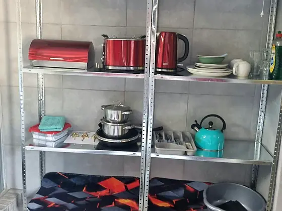 Crockery and kettle shelf in Unit 6